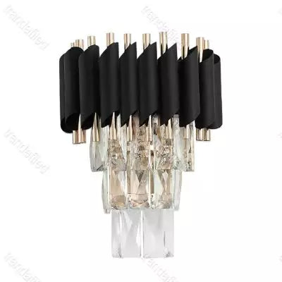 black-and-gold-wall-sconce-with-clear-crystal-pendants-turned-on-mounted-on-wall-elegant-modern-indoor-lighting
