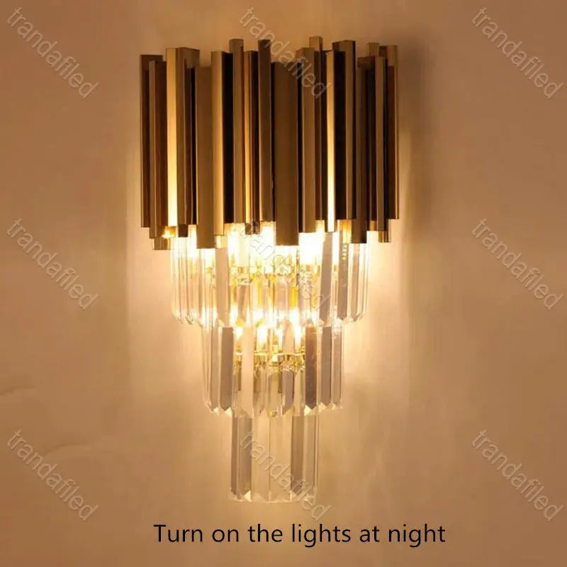 gold-and-crystal-wall-sconce-light-turned-on-mounted-on-wall-warm-ambient-lighting-for-bedroom-hallway-living-room